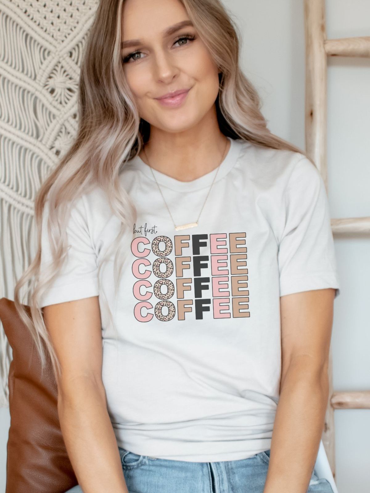 woman wearing tshirt with but first coffee design