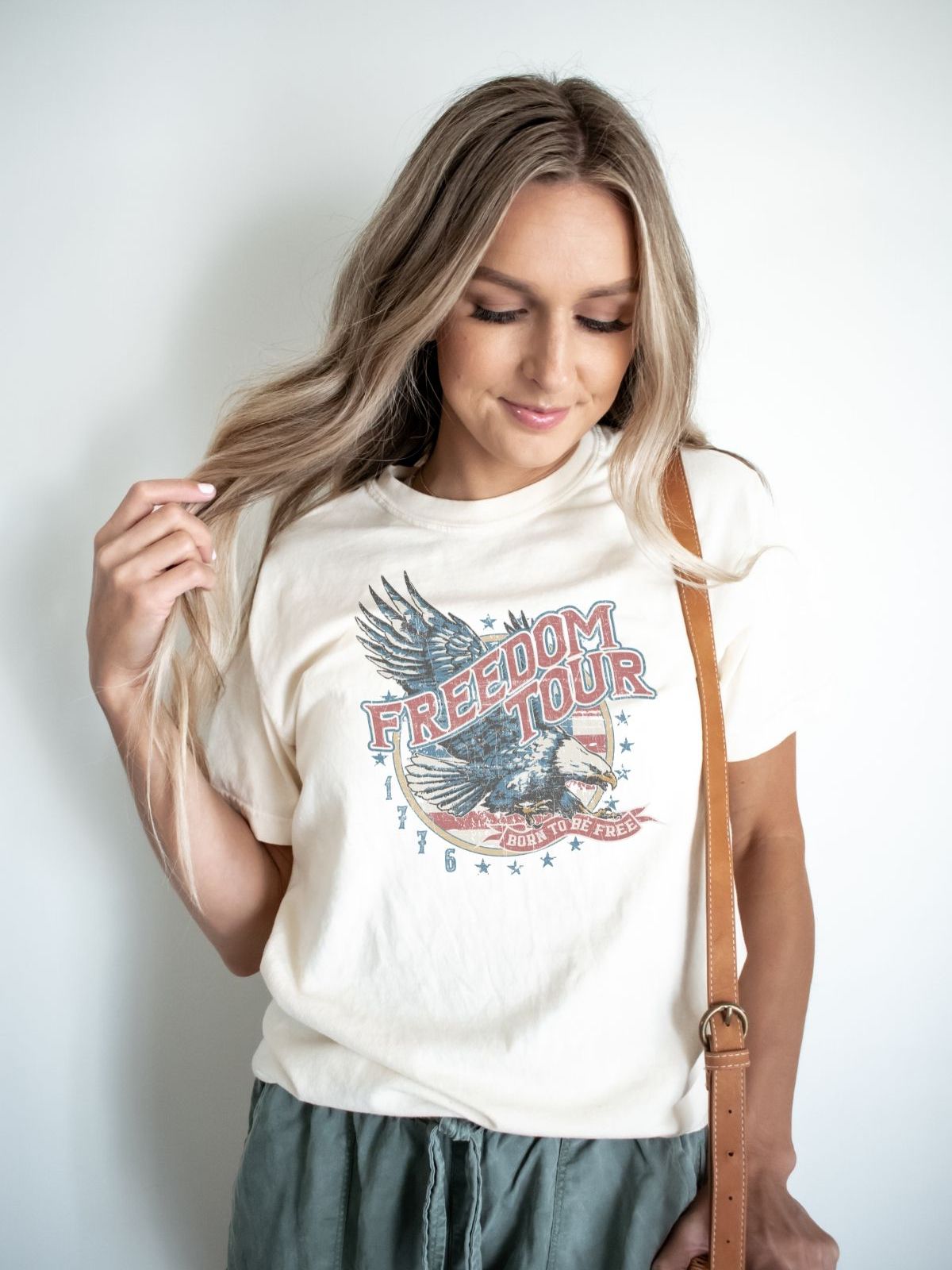 woman wearing a freedom tour t-shirt with eagle design