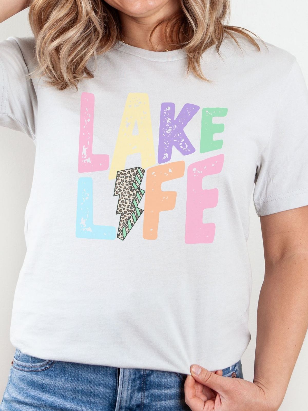 woman wearing a lake life themed t-shirt