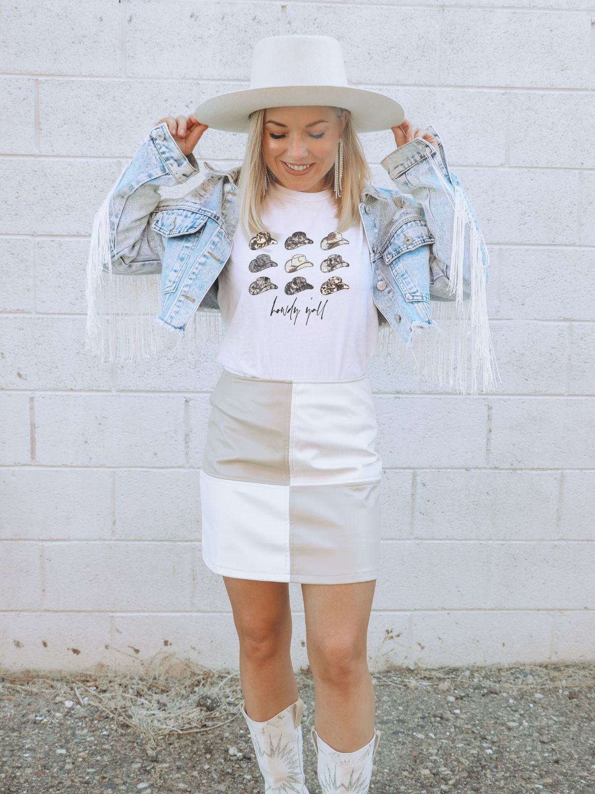 woman wearing a t-shirt with hats and lovely girl text