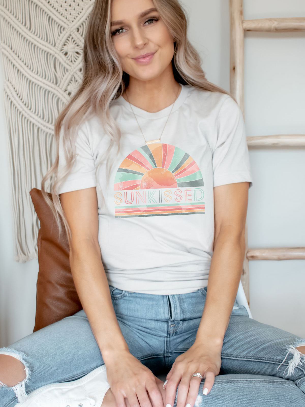 woman wearing a sunkissed graphic t-shirt