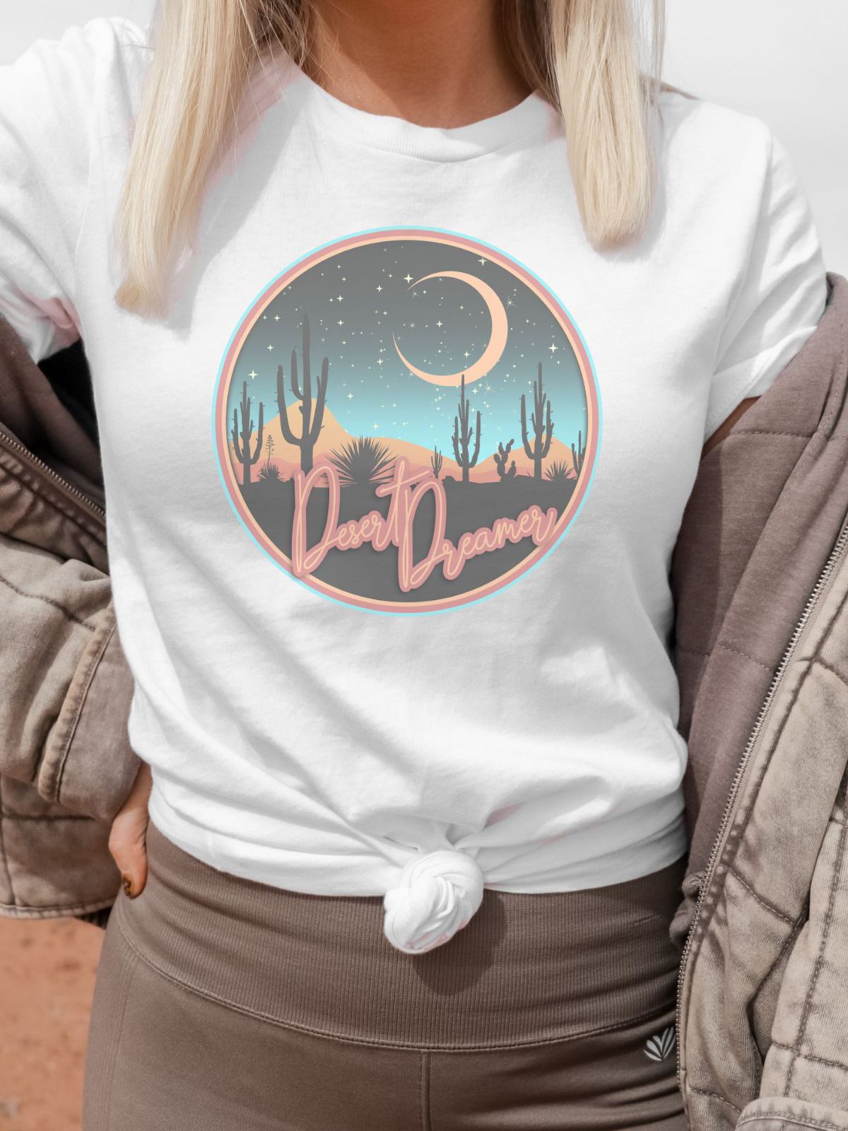 Woman wearing Desert Dreamer t-shirt with moon and cactus design