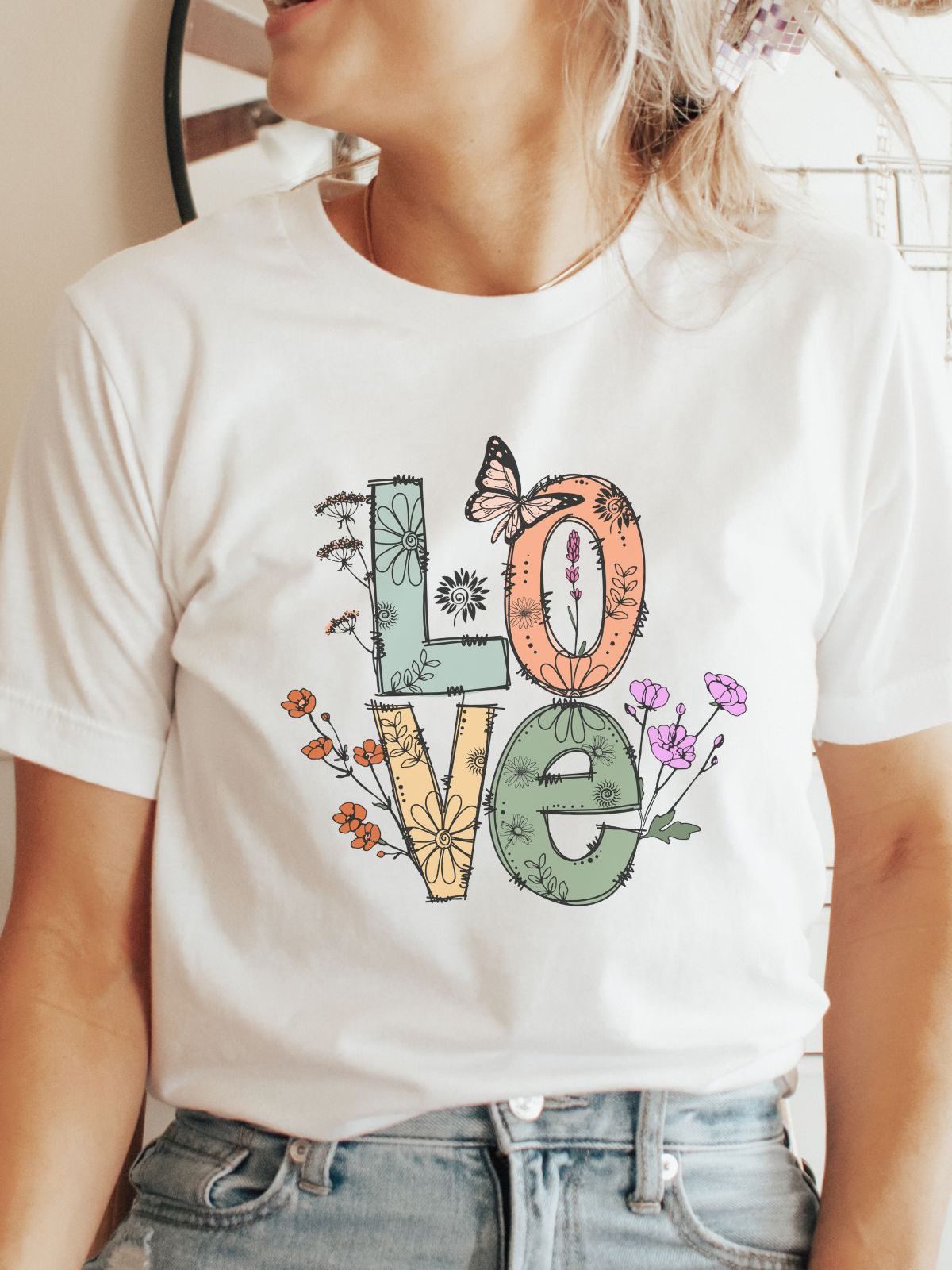 White t-shirt with floral love design and butterfly