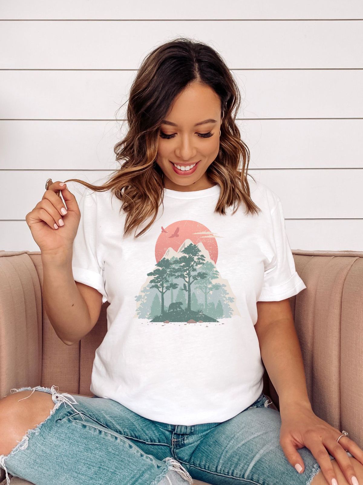 woman wearing a white t-shirt with nature design