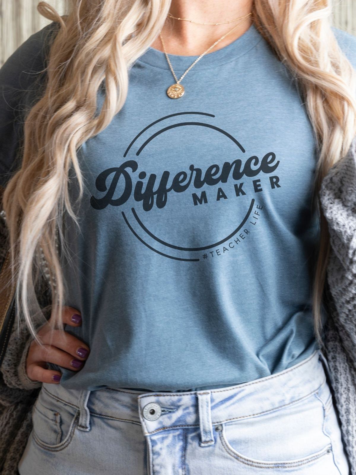 woman wearing blue Difference Maker t-shirt