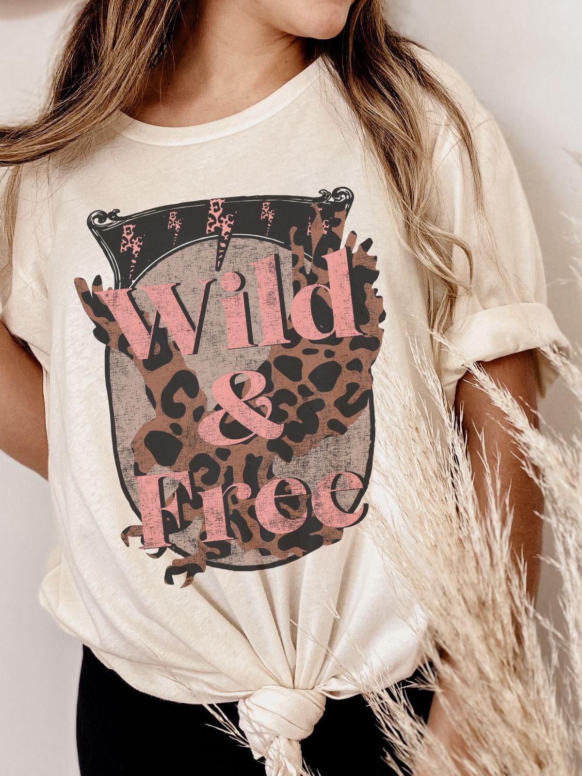 Wild and Free leopard print t-shirt on a woman