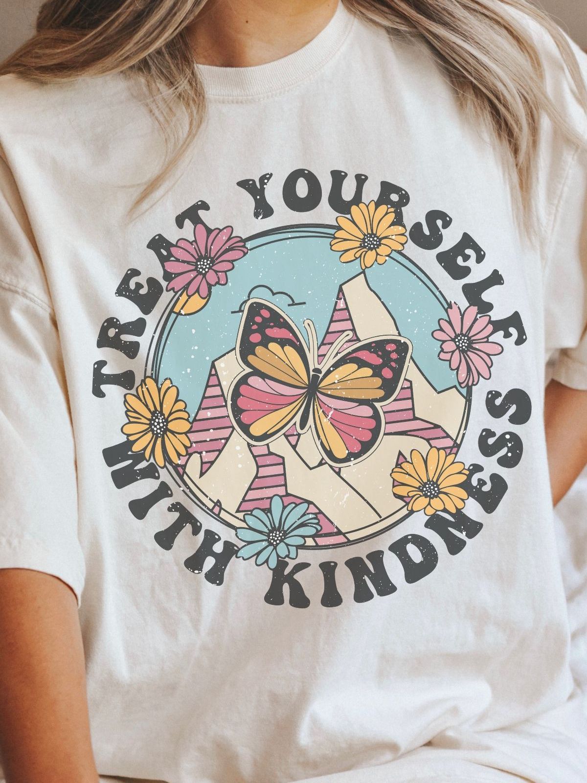 Butterfly and flowers design with text Treat Yourself With Kindness on a t-shirt