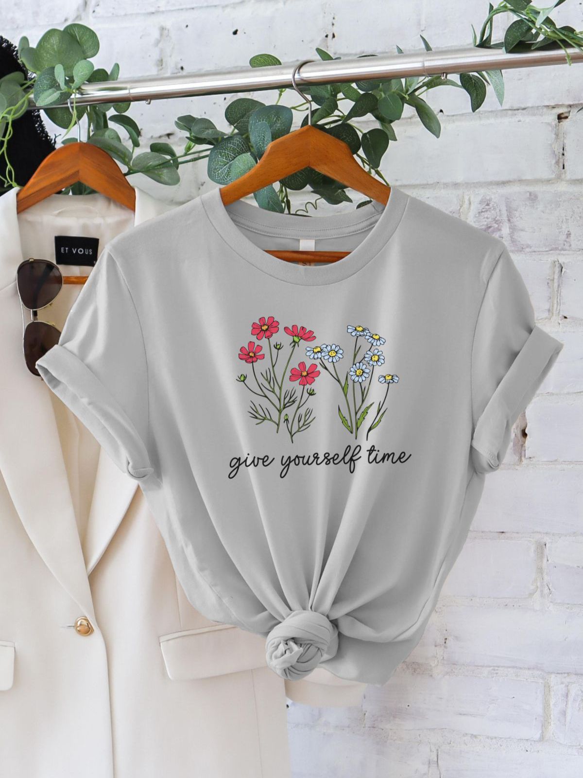 grey t-shirt with floral design and give yourself time text
