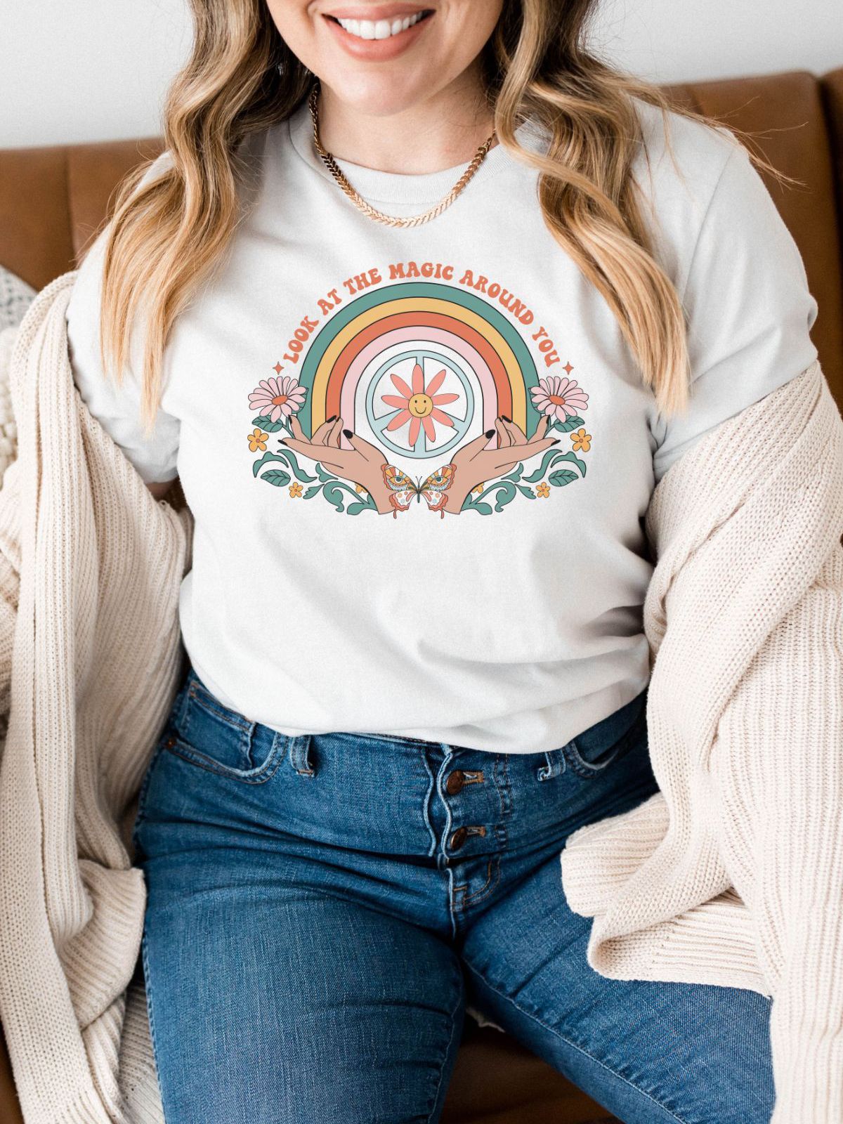 woman wearing t-shirt with rainbow and flower design