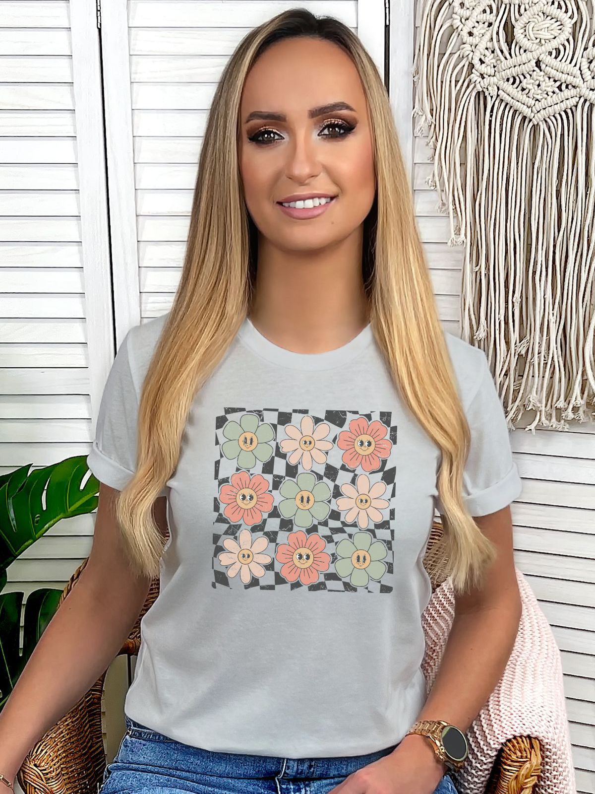 Woman wearing a white t-shirt with floral design