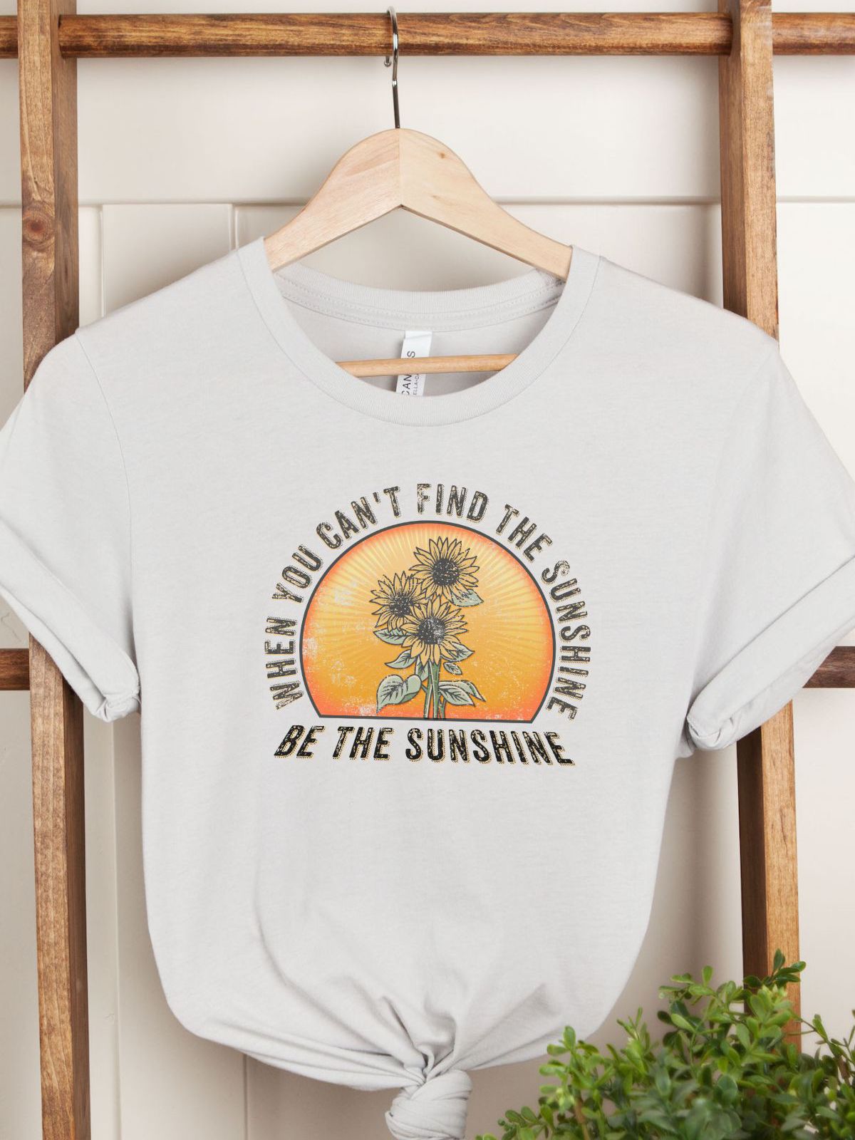 white t-shirt with sunflower and sunshine graphic text