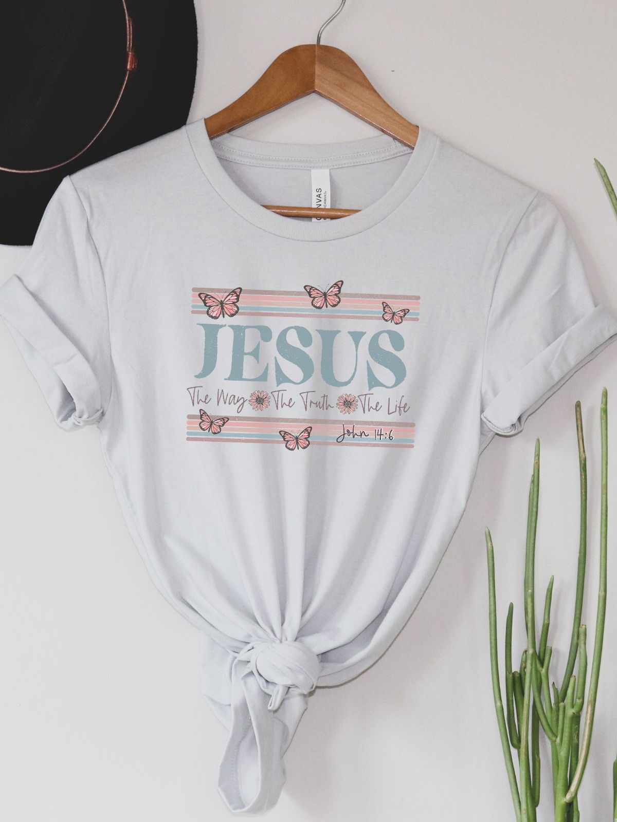 white t-shirt with Jesus text and butterflies design