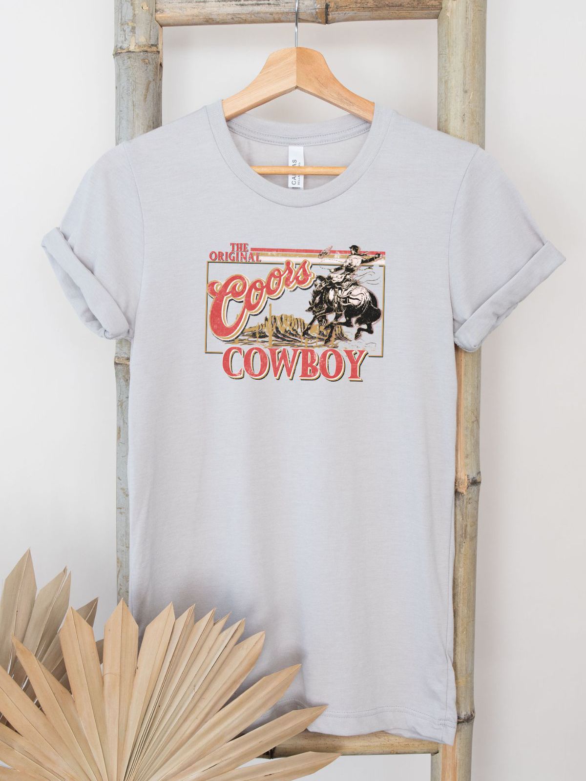 light grey t-shirt with cowboy graphic design