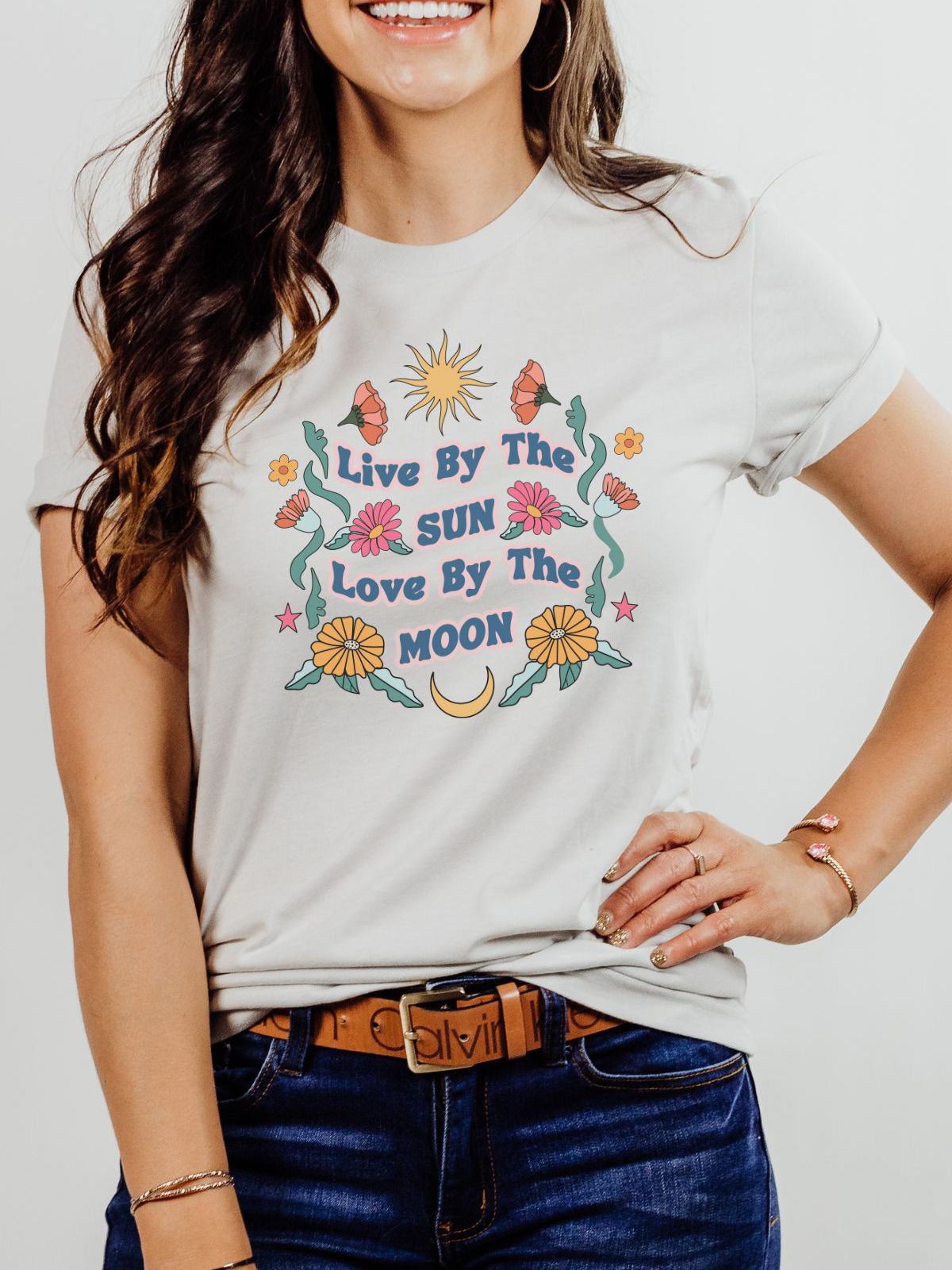 Woman wearing t-shirt with floral sun moon design