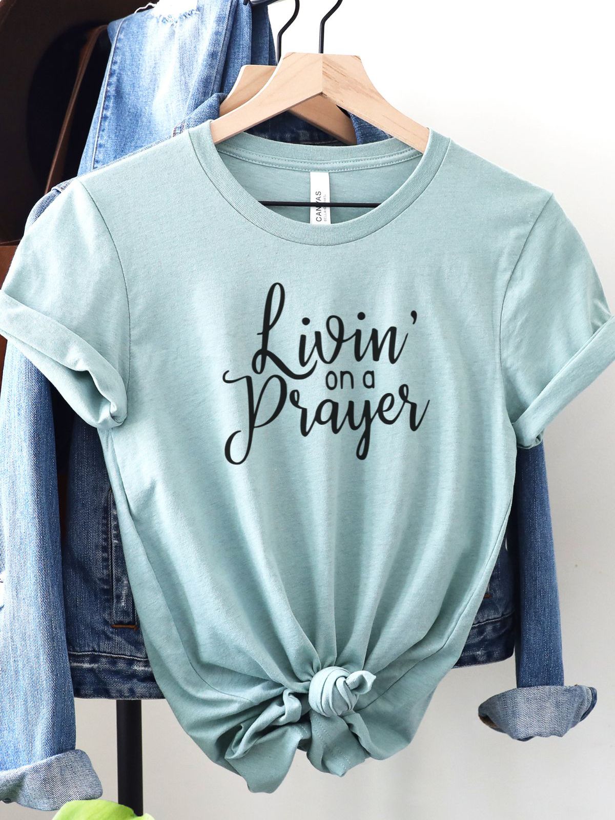 Livin on a Prayer t-shirt hanging on rack