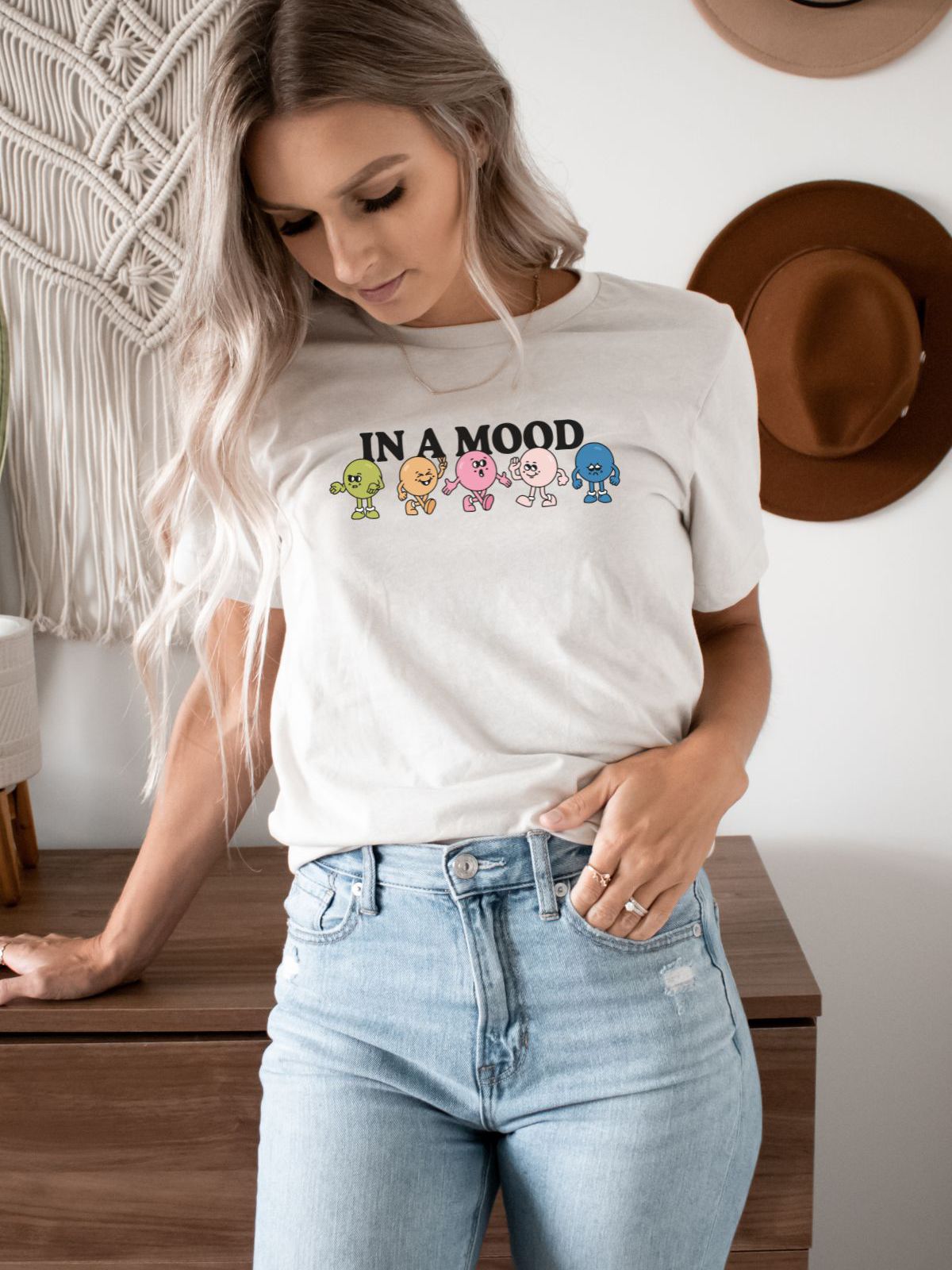 woman wearing 'In a Mood' graphic tee
