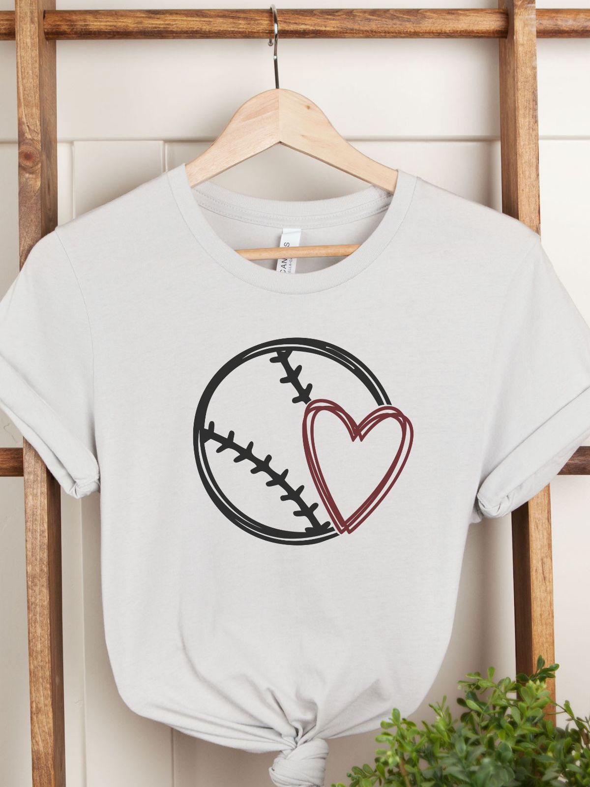 white t-shirt with baseball and heart design