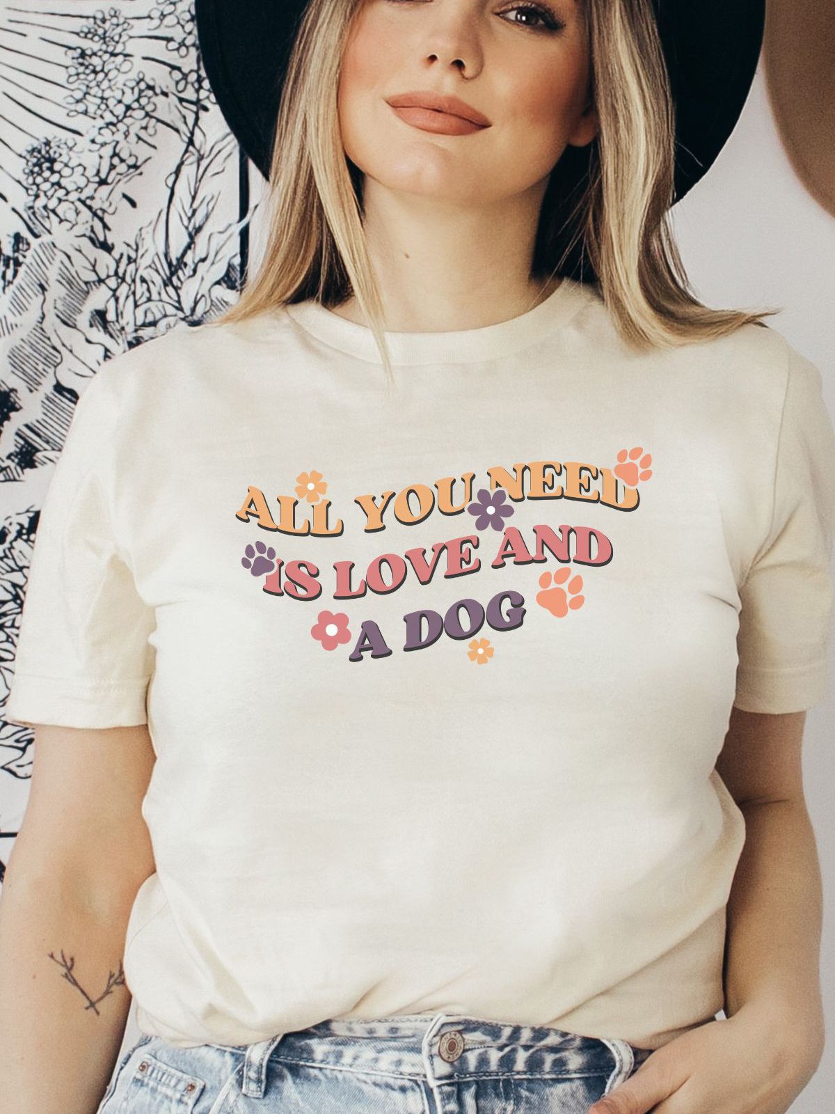 Woman wearing t-shirt with 'All You Need is Love and a Dog'