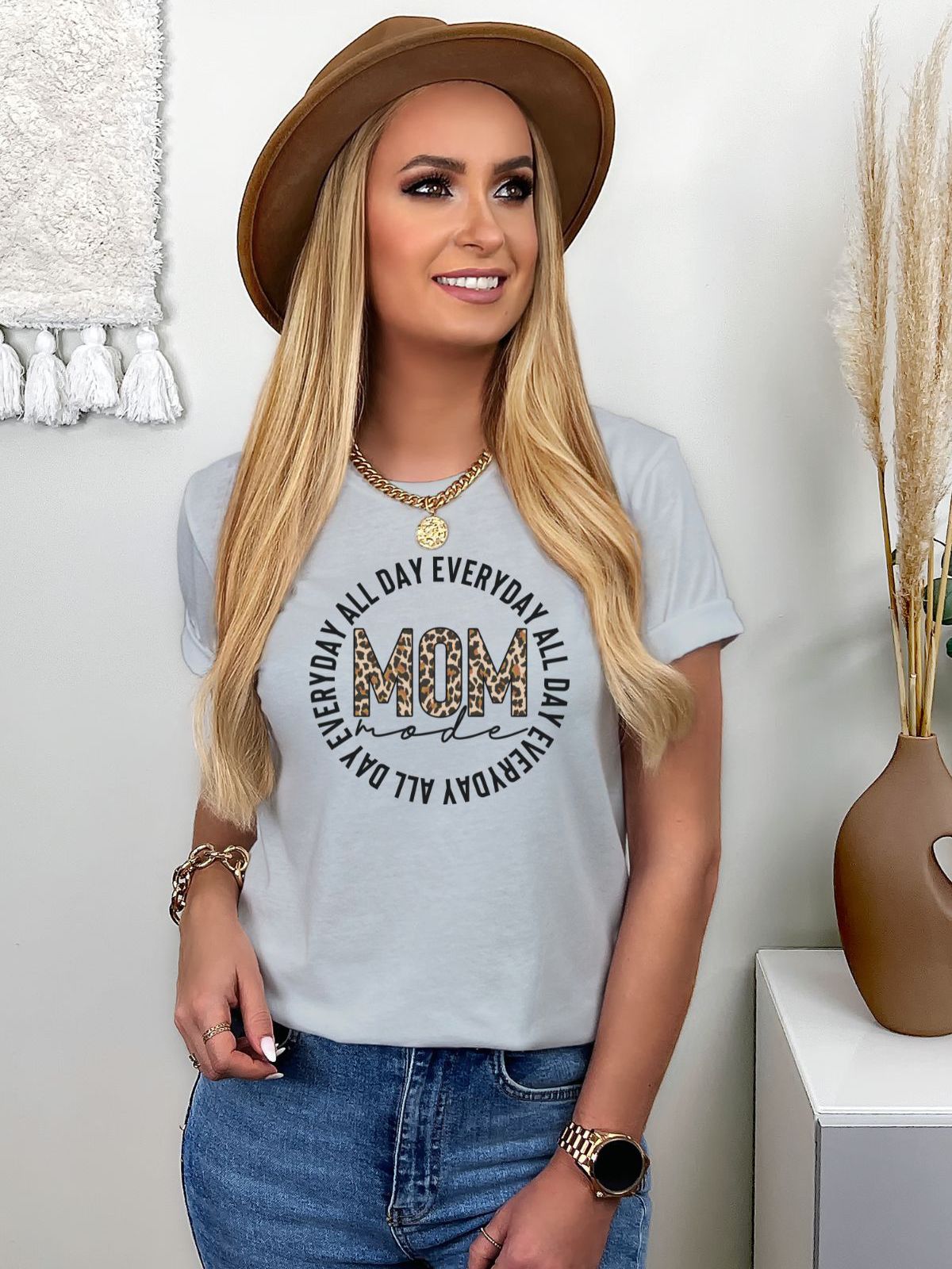Woman wearing Mom Mode TShirt with leopard print design