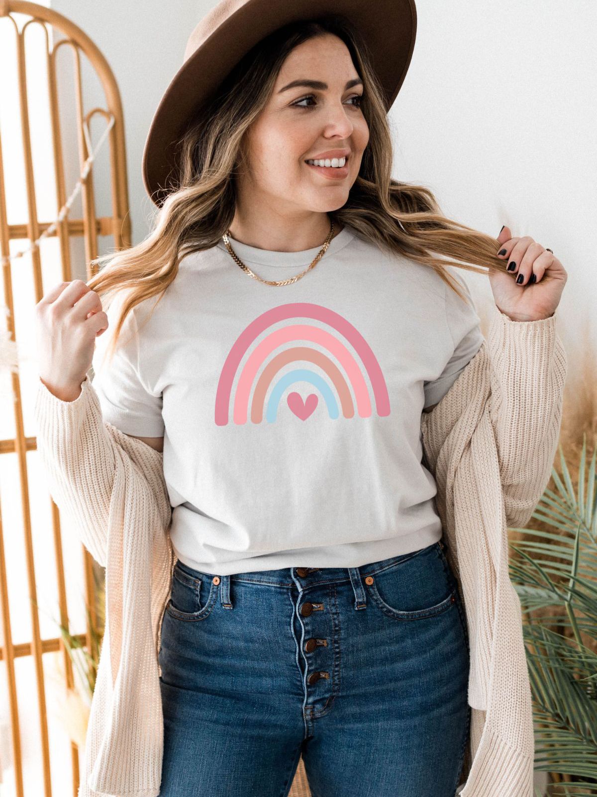 woman wearing rainbow heart graphic tee
