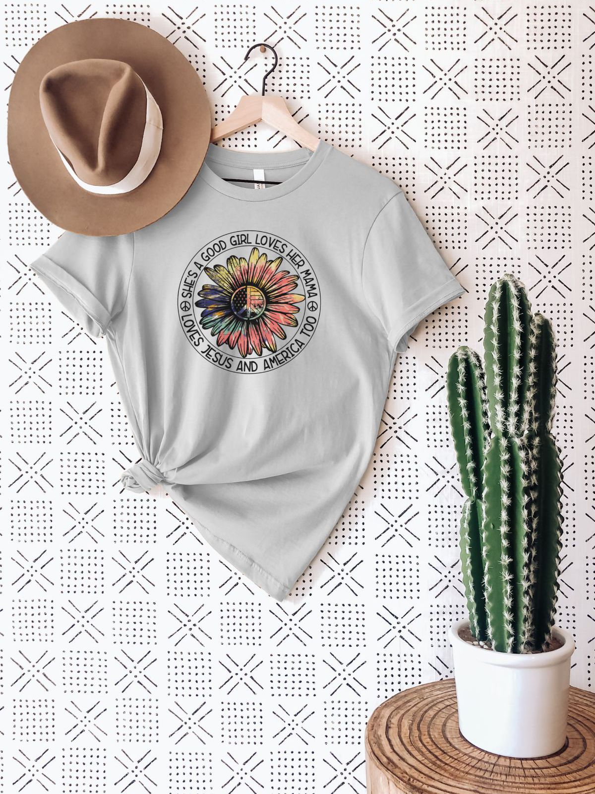 Gray t-shirt with daisy and text 'She's A Good Girl Loves Her Mama Loves Jesus And America Too'