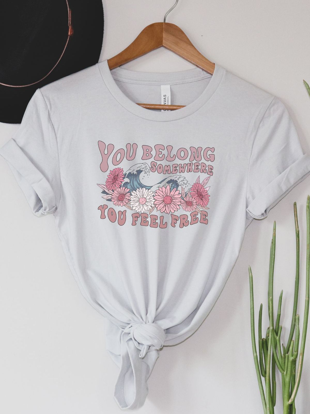 T-shirt with You Belong Somewhere You Feel Free text and floral design