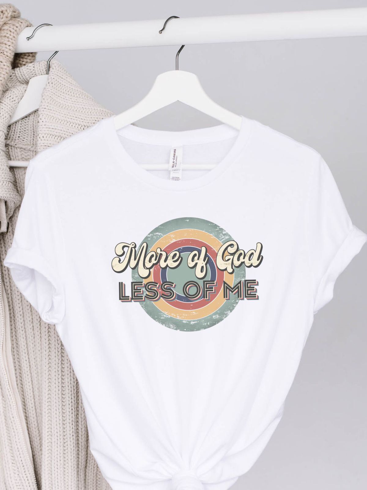 White t-shirt with More of God Less of Me text