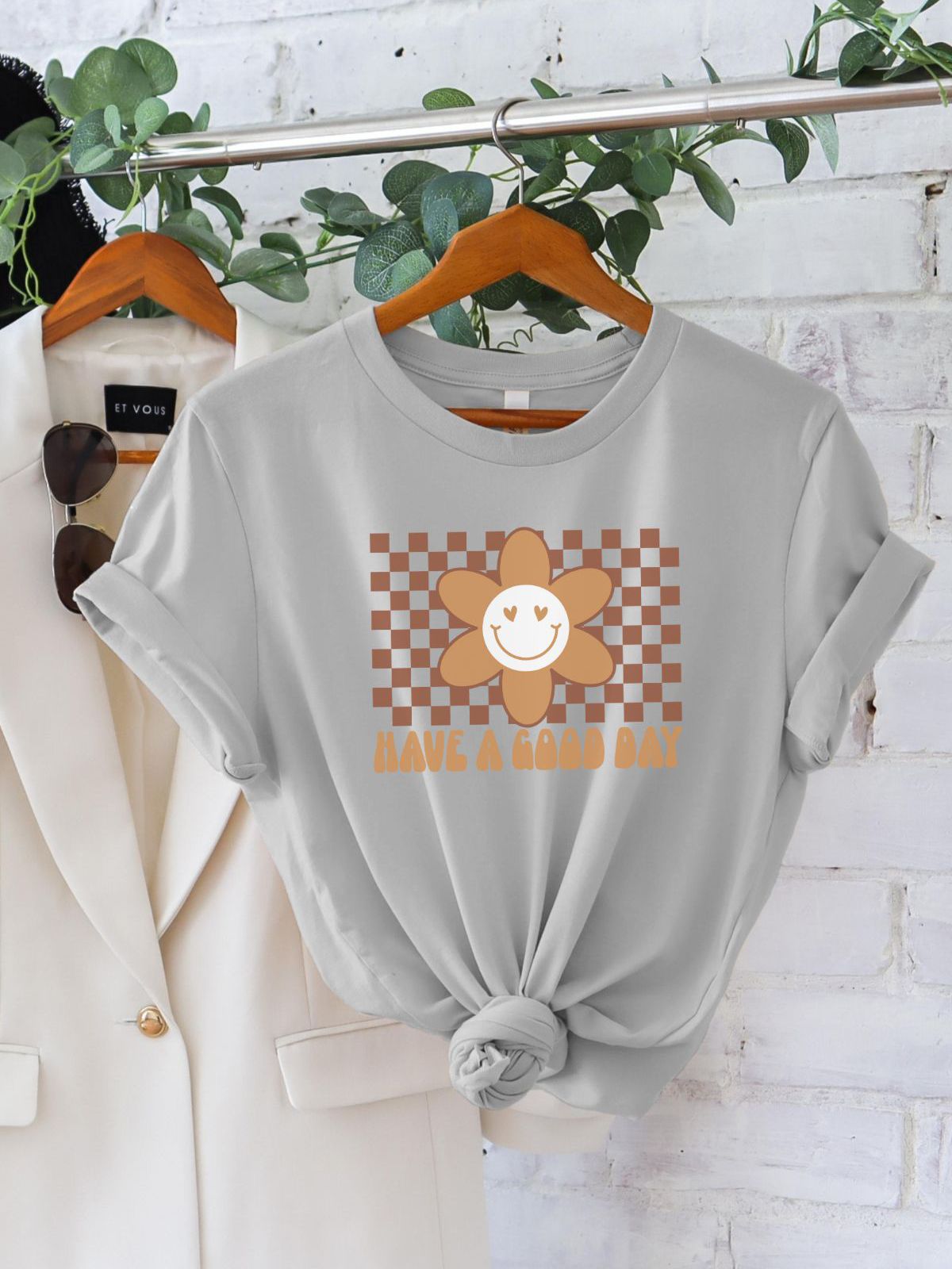 Grey t-shirt with smiley flower design saying have a good day