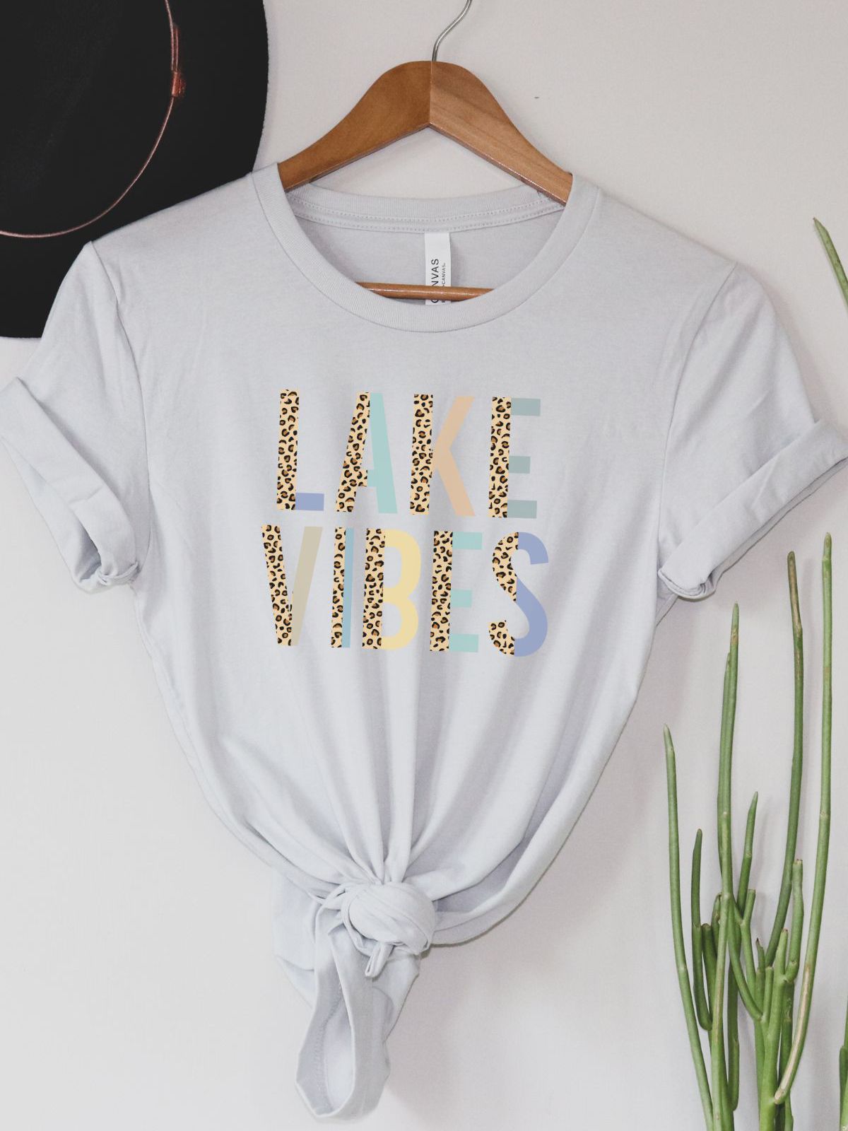 Lake Vibes text on a women's t-shirt with casual styling