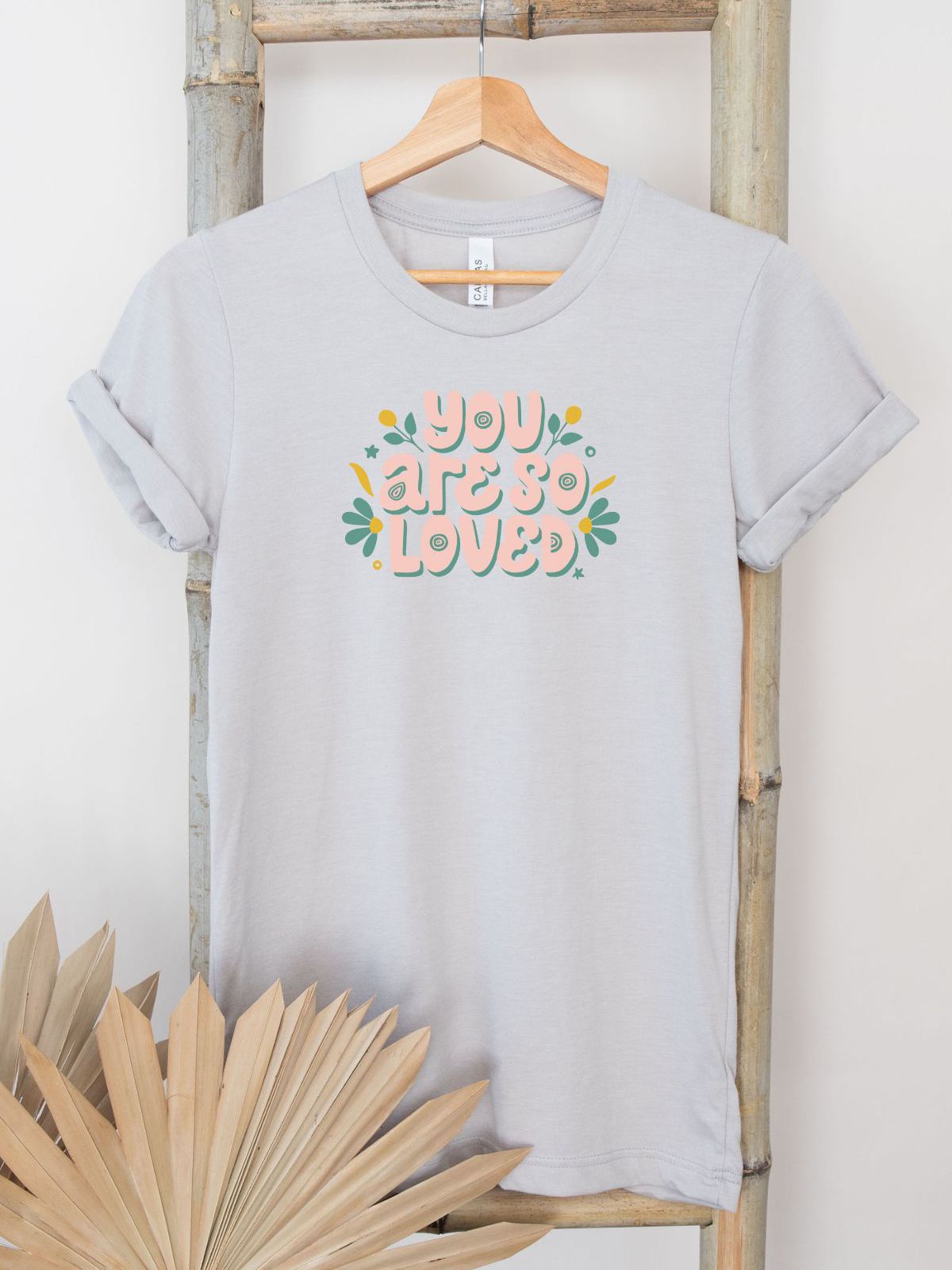 You Are So Loved graphic t-shirt on hanger