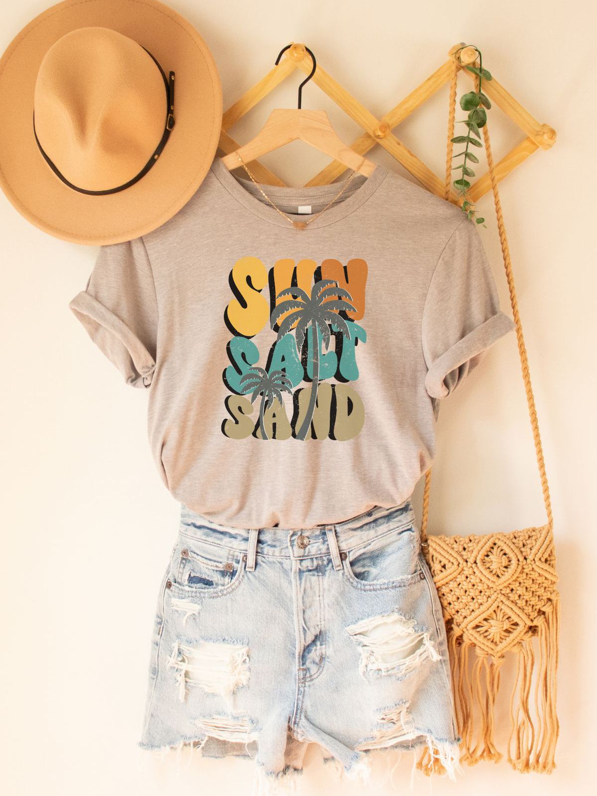 beige t-shirt with sun salt sand text and tropical design