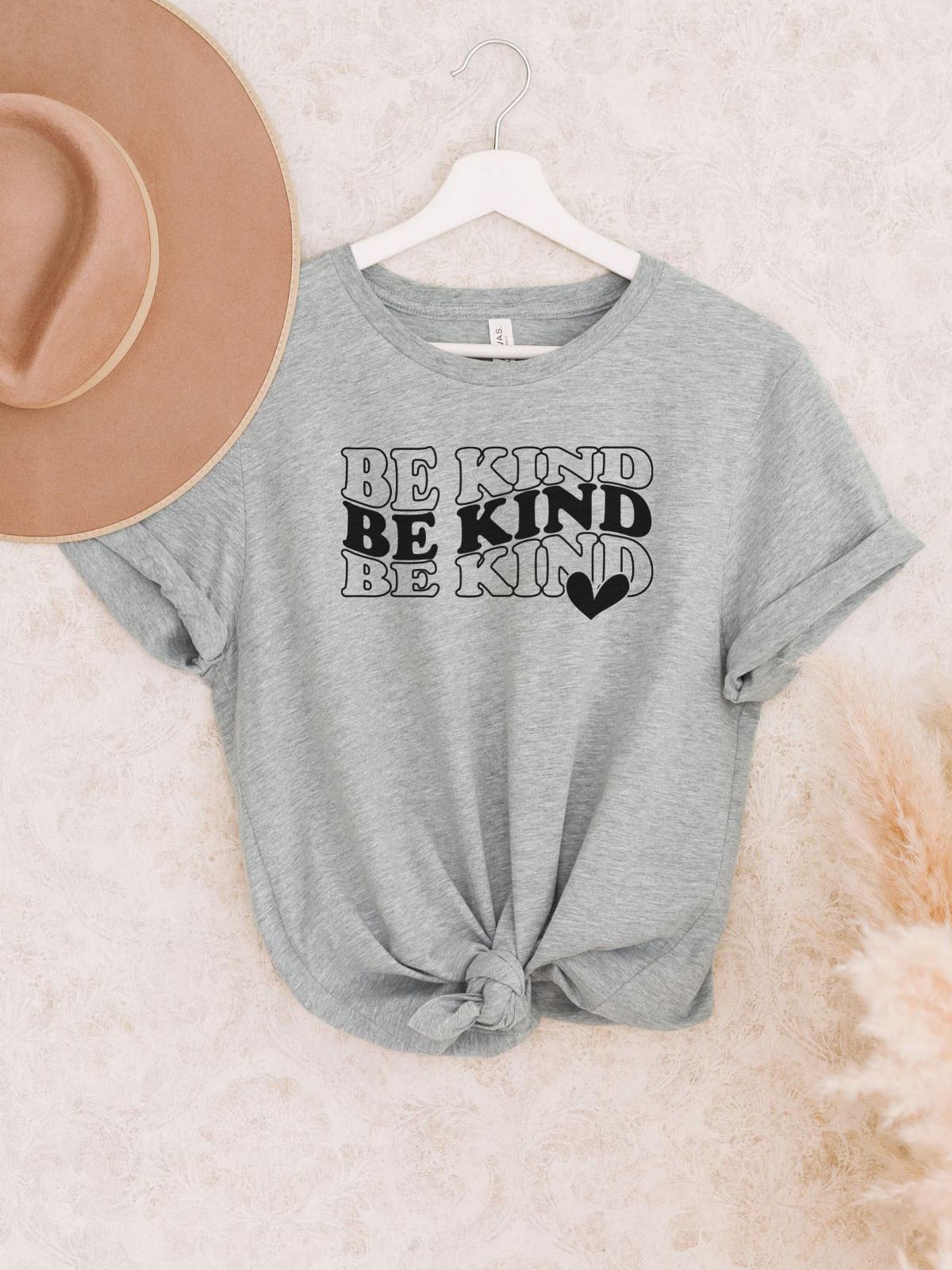 Gray T-shirt with Be Kind text and heart design