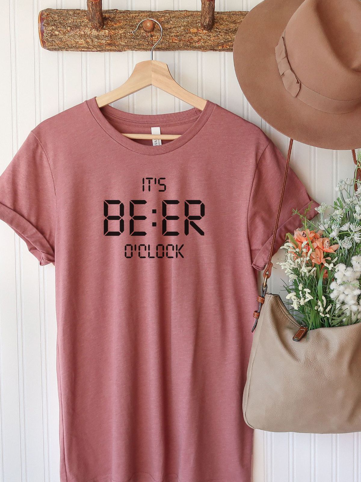 pink t shirt with its beer o clock text