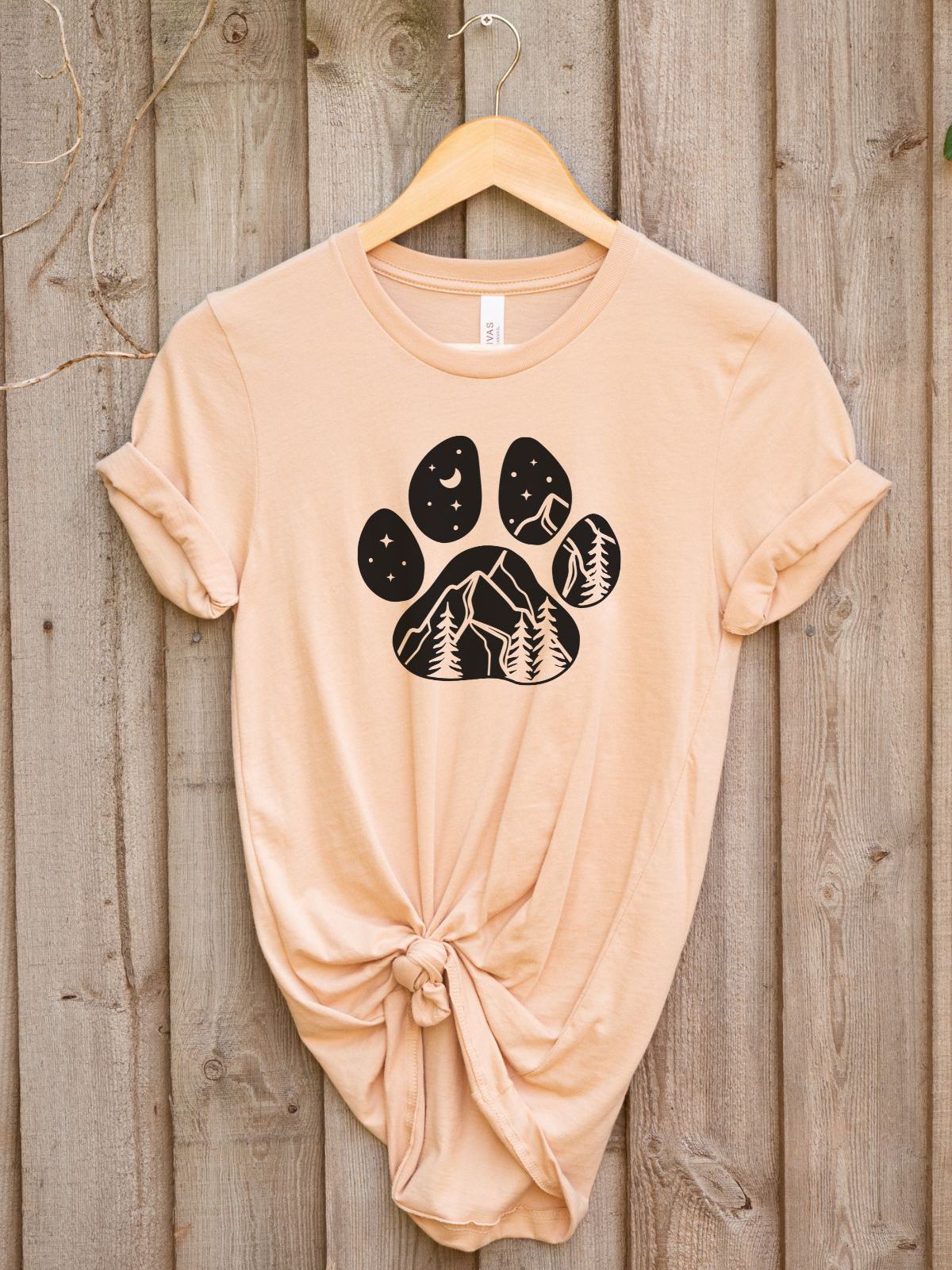 beige t-shirt with bear paw and nature design