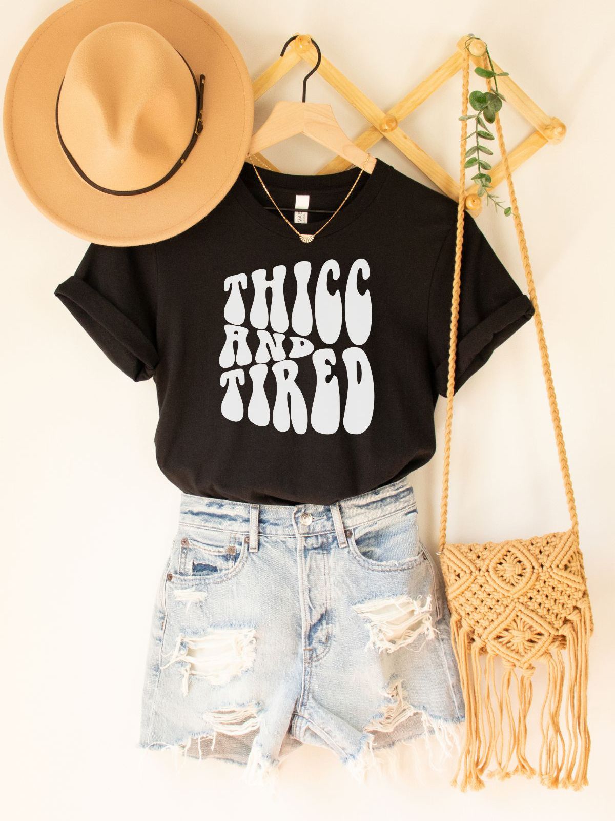 black t-shirt with thicc and tired text