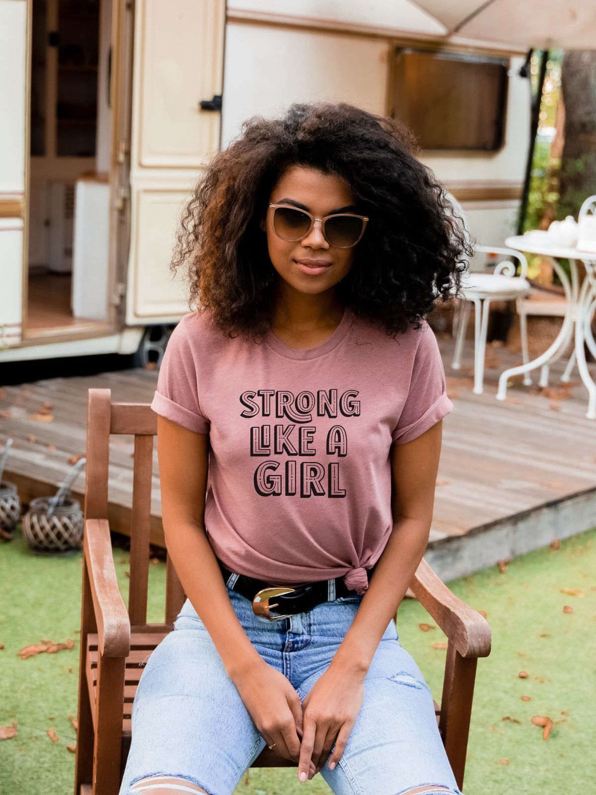 Woman wearing Strong Like a Girl t-shirt outdoors