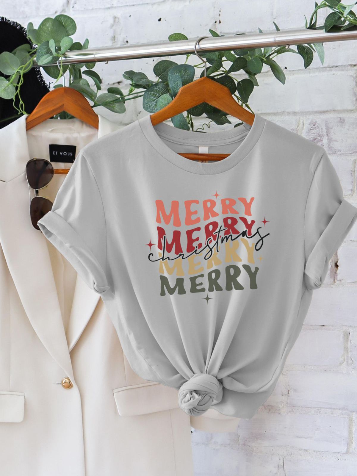 Merry Christmas design t-shirt on hanger