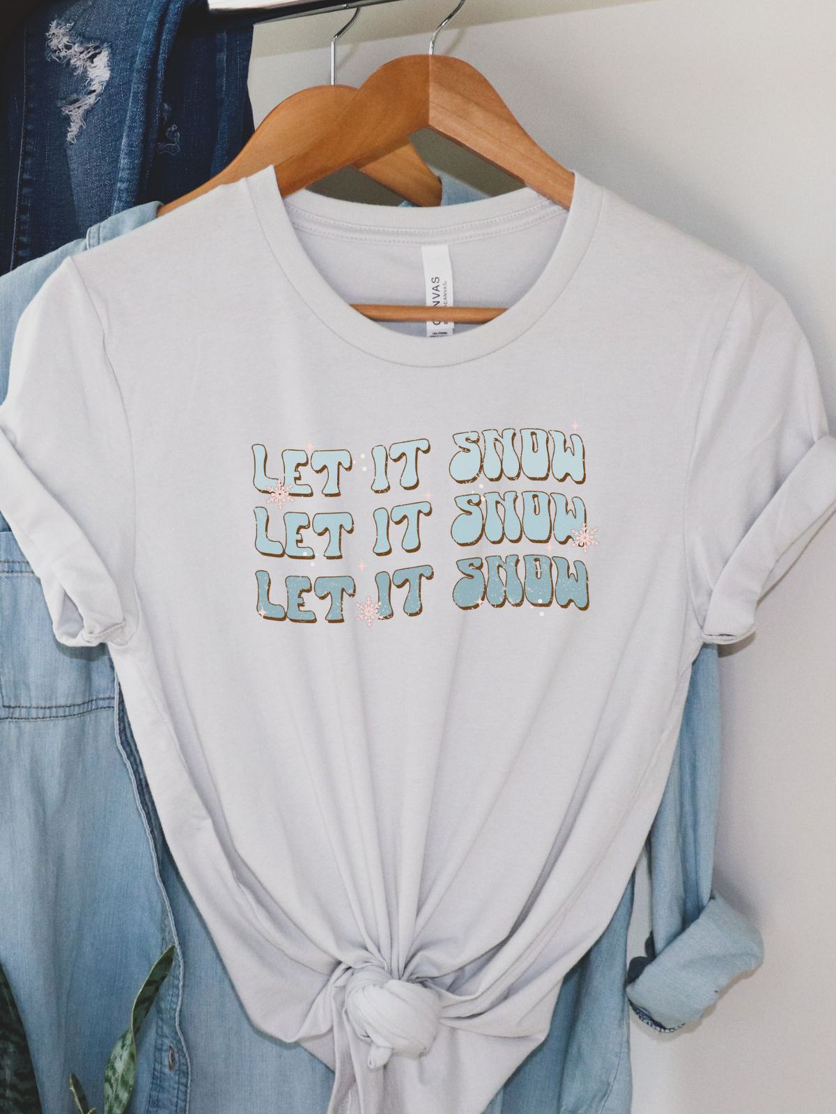 Let It Snow graphic tee on hanger