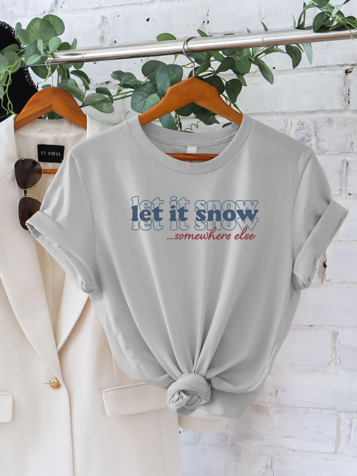 Let It Snow Somewhere Else T-Shirt on hanger