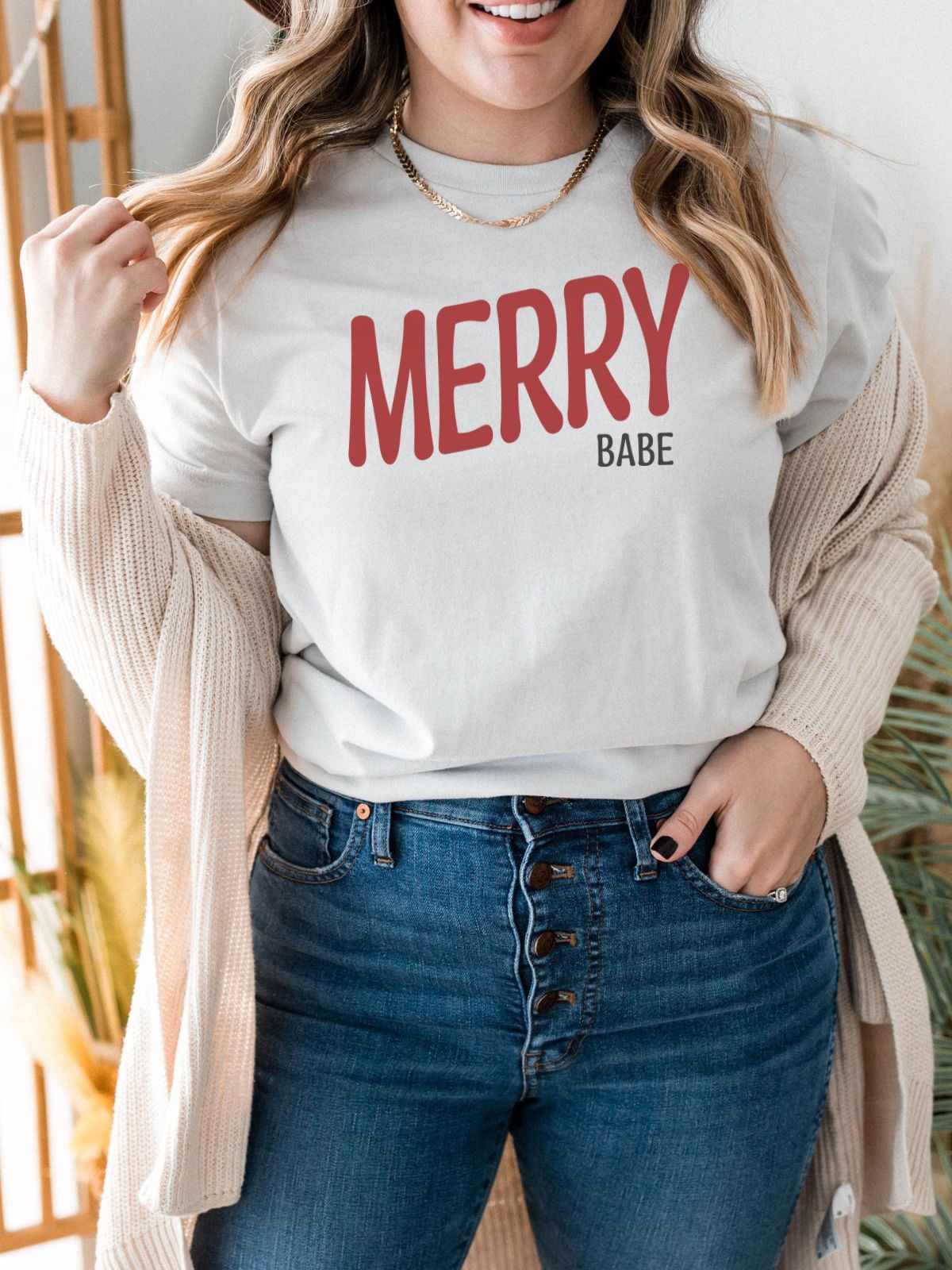 woman wearing merry babe christmas t-shirt