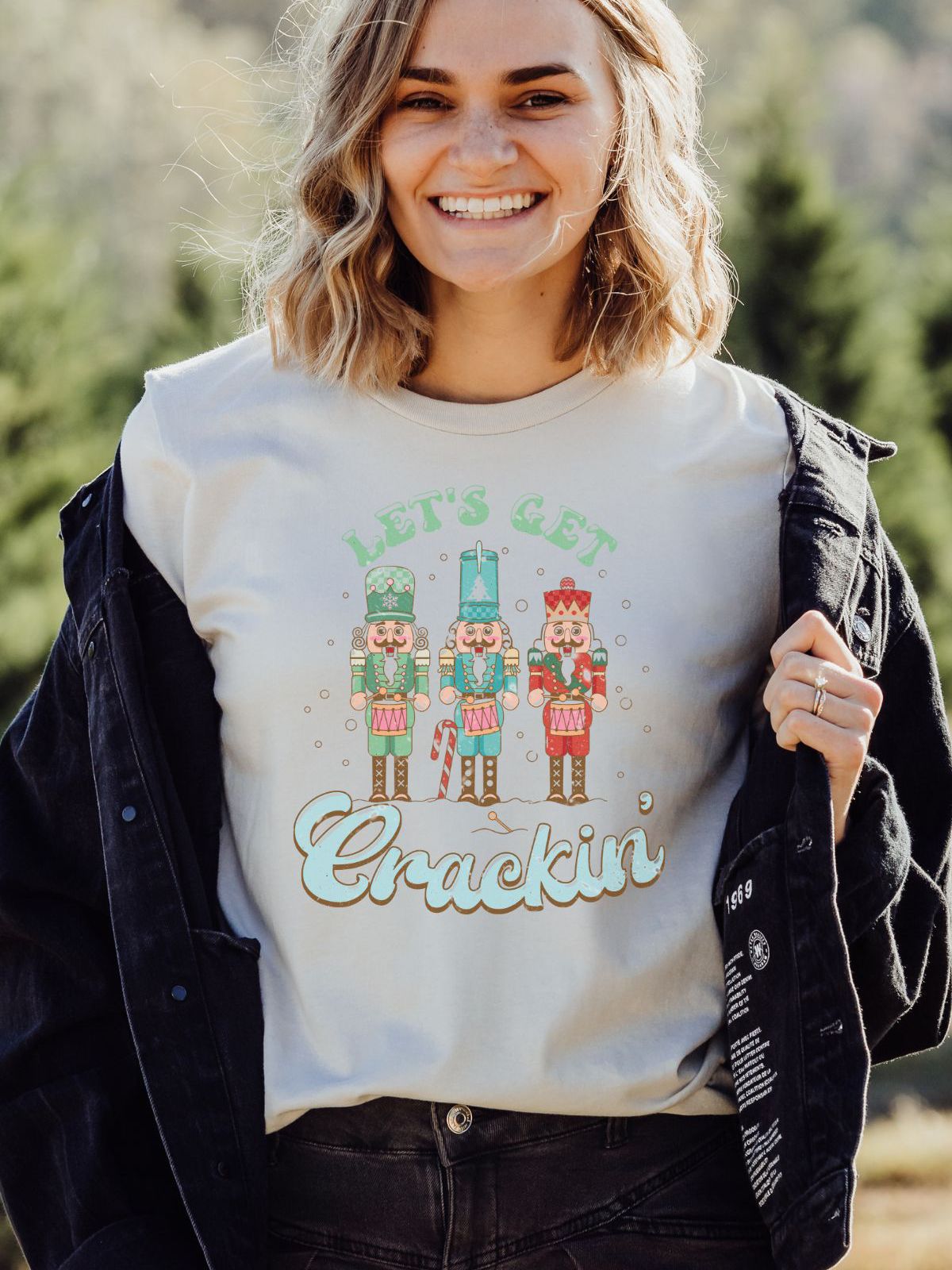 woman wearing let's get crackin nutcracker t-shirt