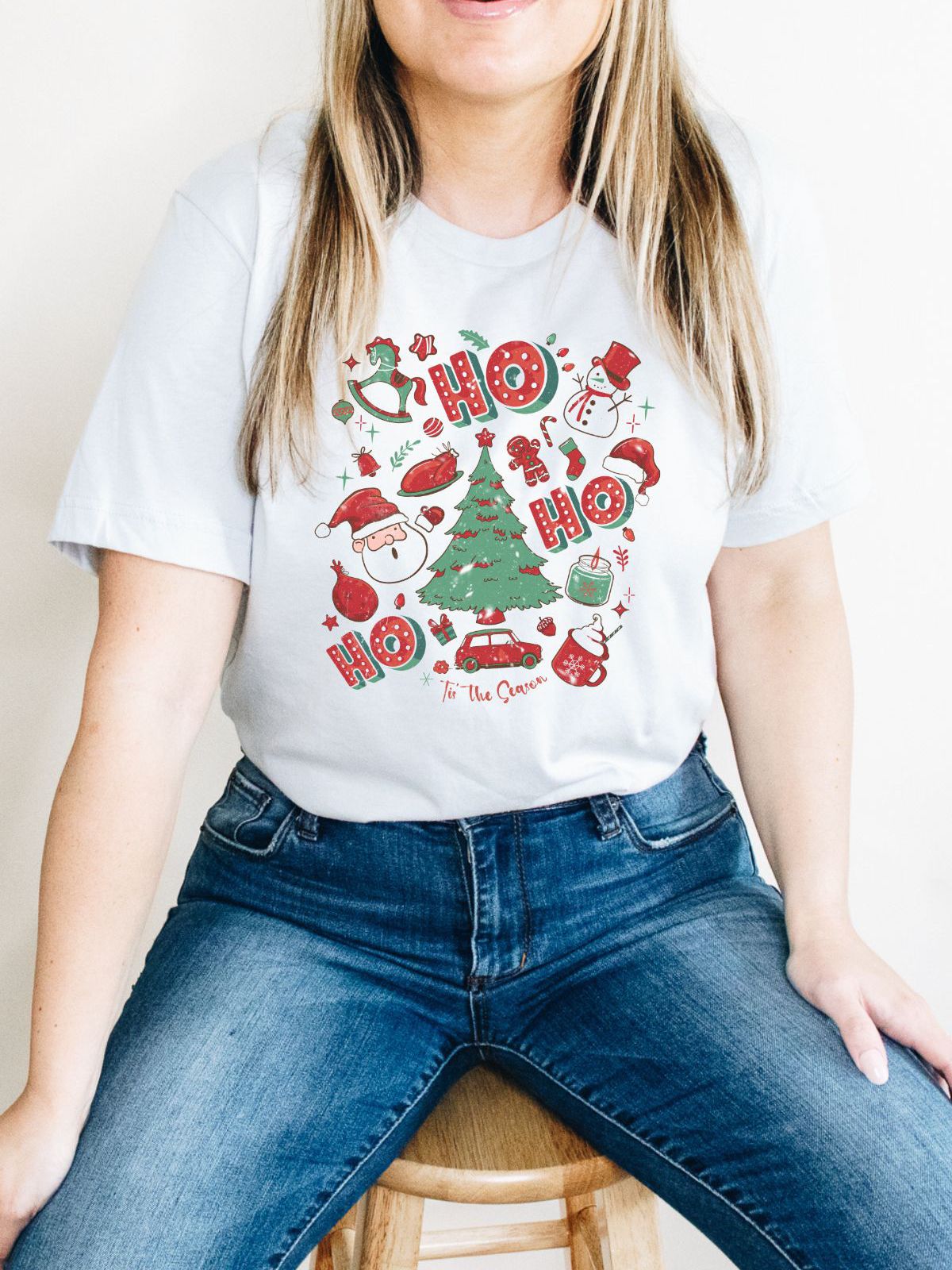 woman wearing Christmas themed t-shirt with festive design