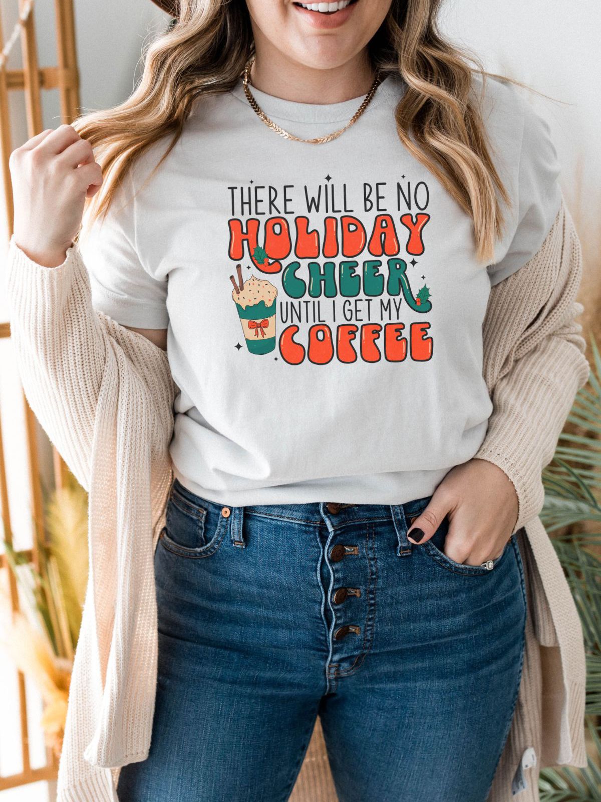 woman wearing holiday cheer coffee t-shirt
