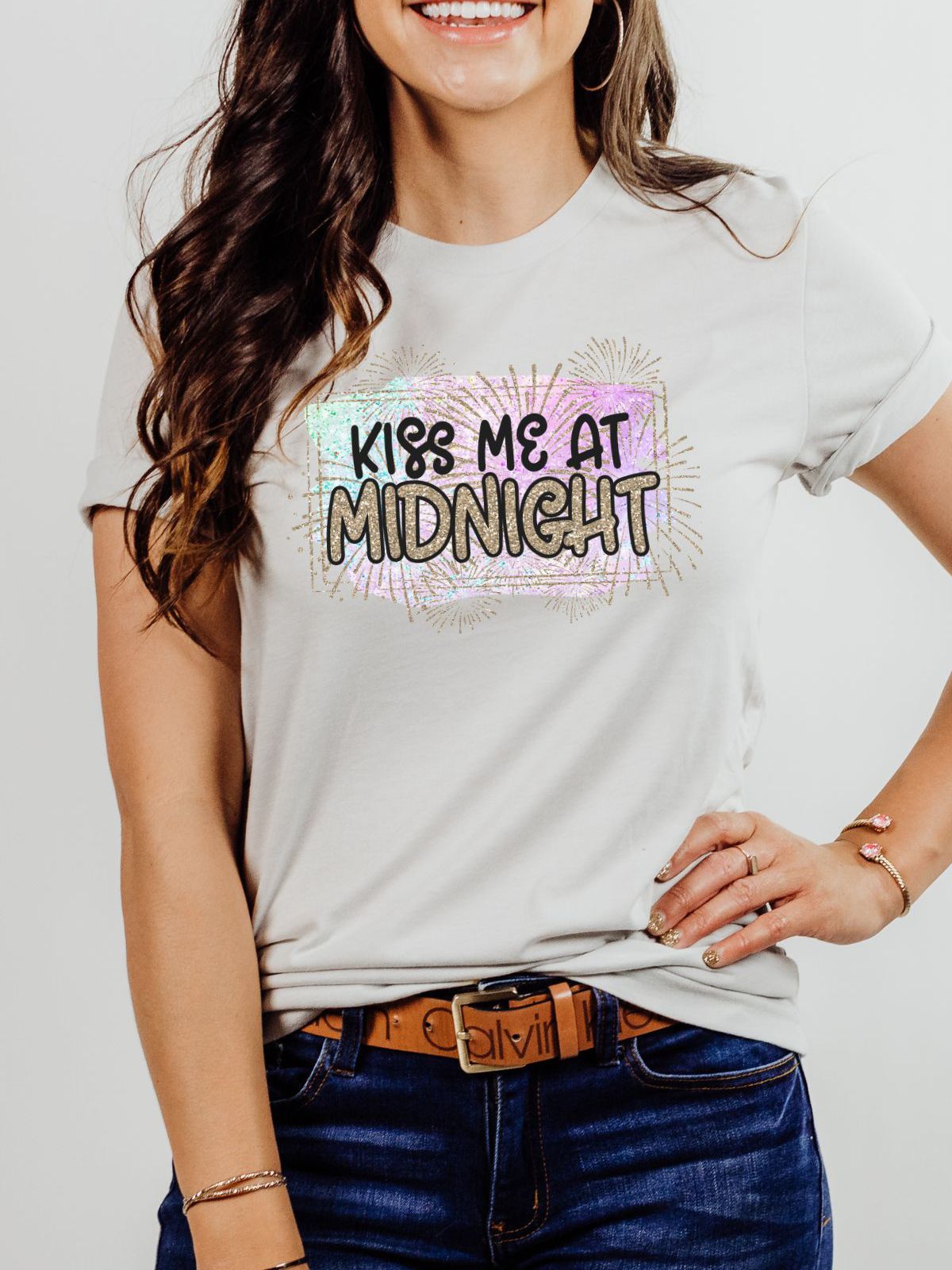 woman wearing kiss me at midnight new year shirt